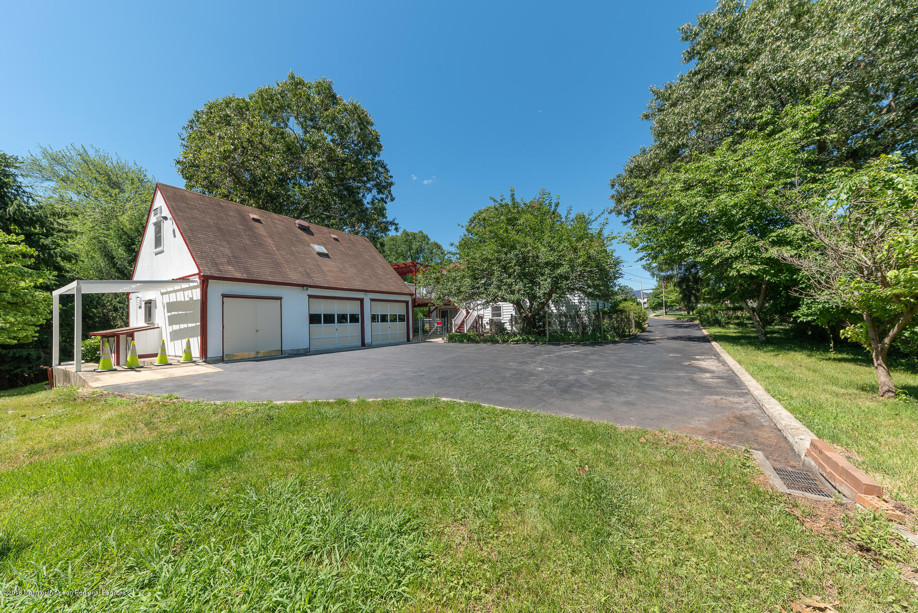 195 South New Prospect Road Jackson, NJ 08527 - Photo 27 of 28 a front view of house with yard and trees in the background