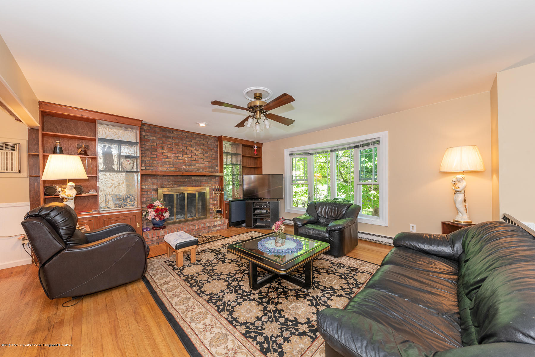 195 South New Prospect Road Jackson, NJ 08527 - Photo 5 of 28 a living room with furniture fireplace and a large window
