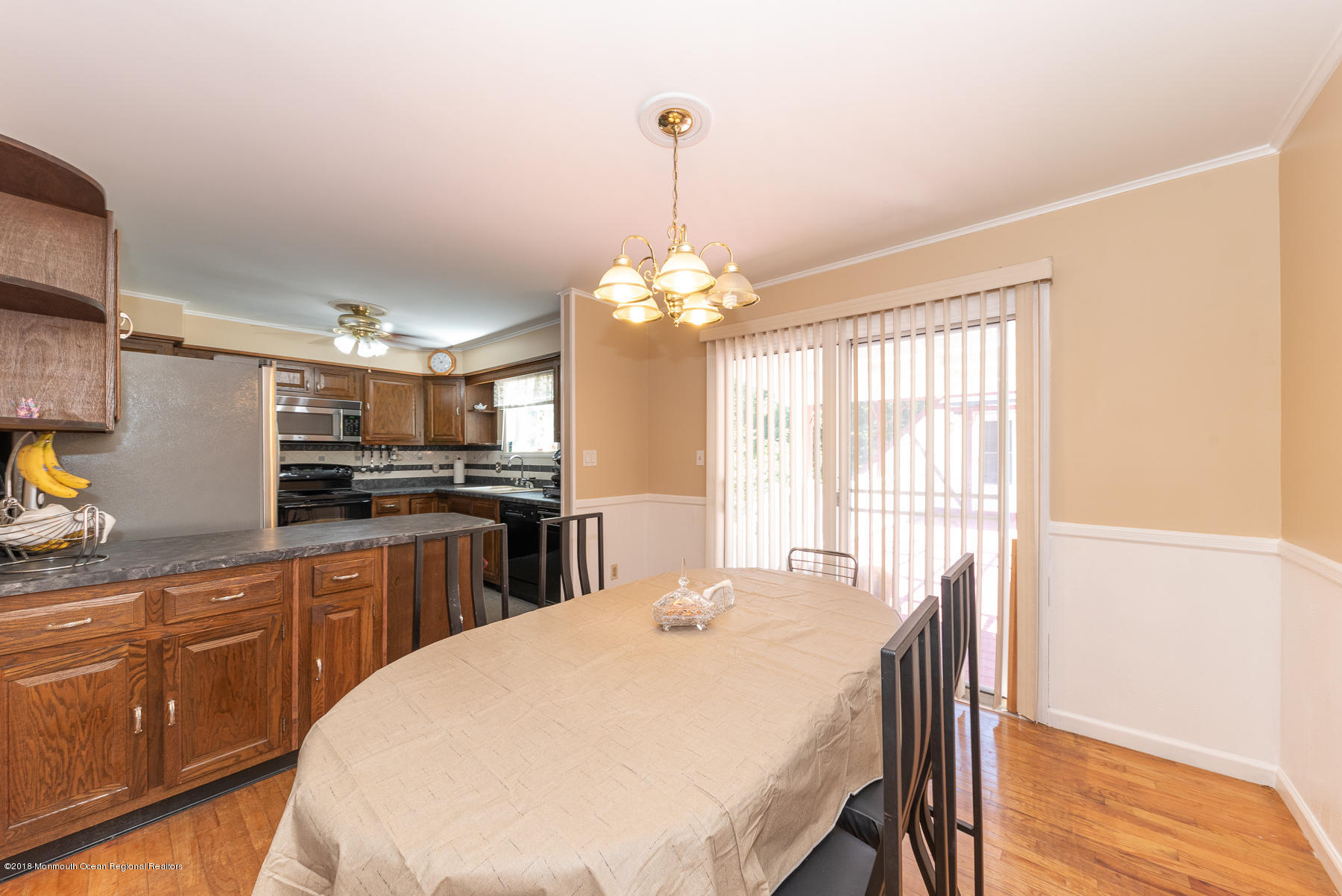 195 South New Prospect Road Jackson, NJ 08527 - Photo 7 of 28 a kitchen with stainless steel appliances kitchen island granite countertop a sink a stove a dining table and chairs