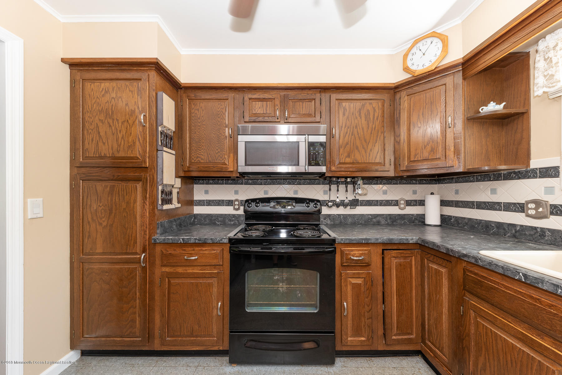 195 South New Prospect Road Jackson, NJ 08527 - Photo 10 of 28 a kitchen with a stove and a microwave