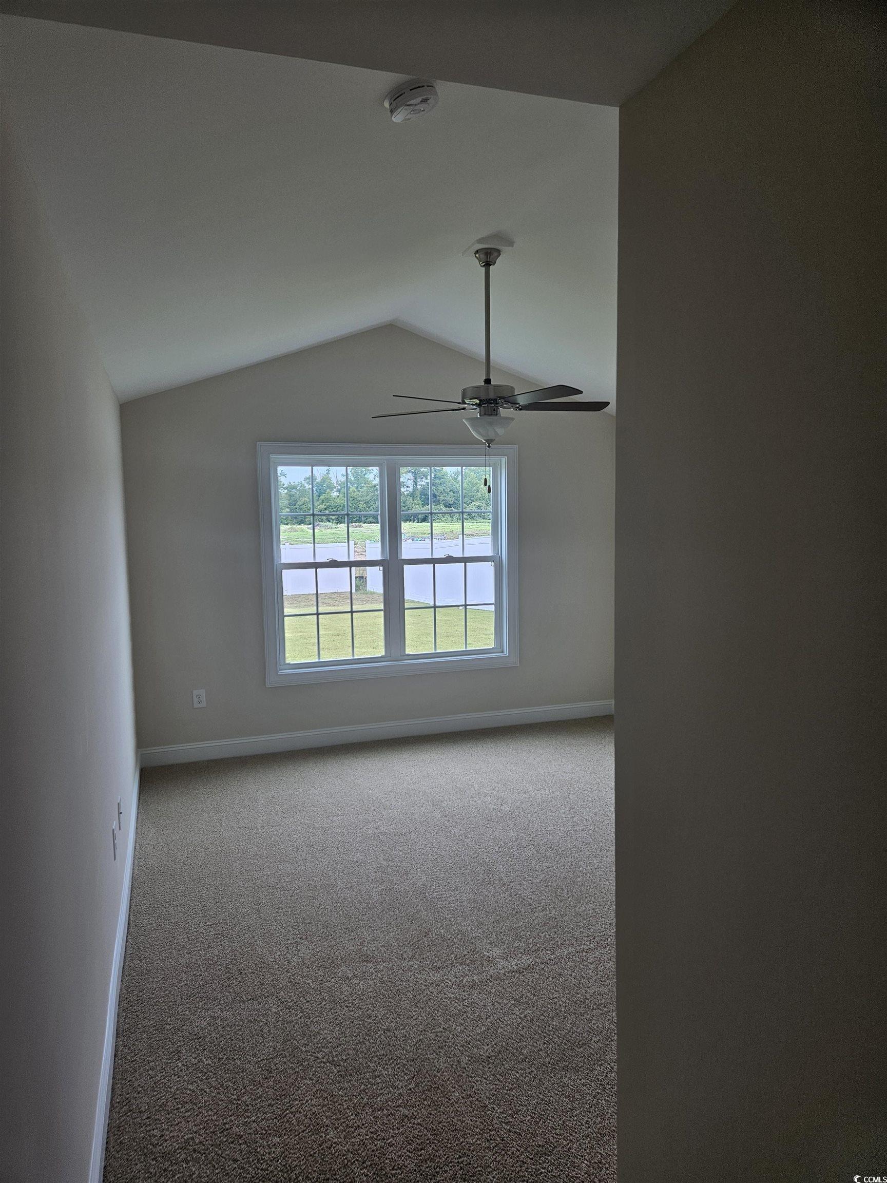 416 Hallie Martin Road Conway, SC 29527 - Photo 12 of 24 Carpeted empty room featuring vaulted ceiling and