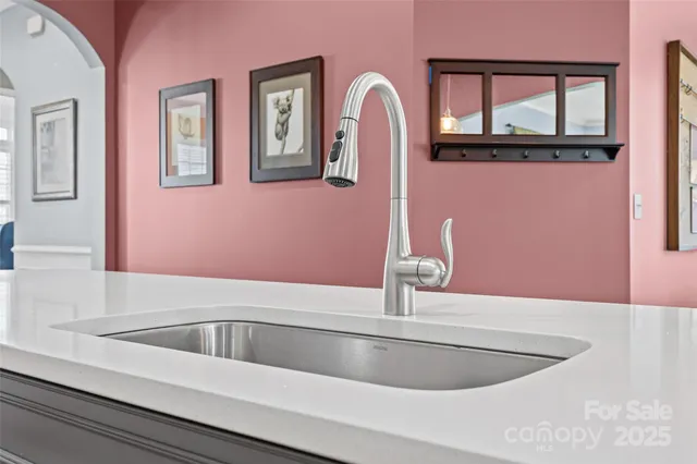 a dining room with a wooden table and chairs