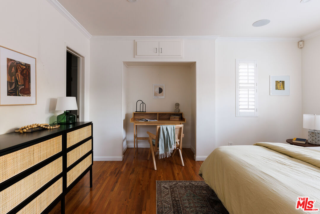 1640 Ard Eevin Avenue Glendale, CA 91202 - Photo 15 of 32 a bedroom with a bed and a table in it