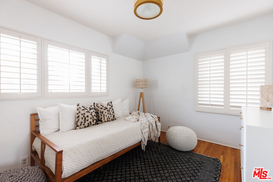 1640 Ard Eevin Avenue Glendale, CA 91202 - Photo 23 of 32 a bedroom with a bed and wooden floor