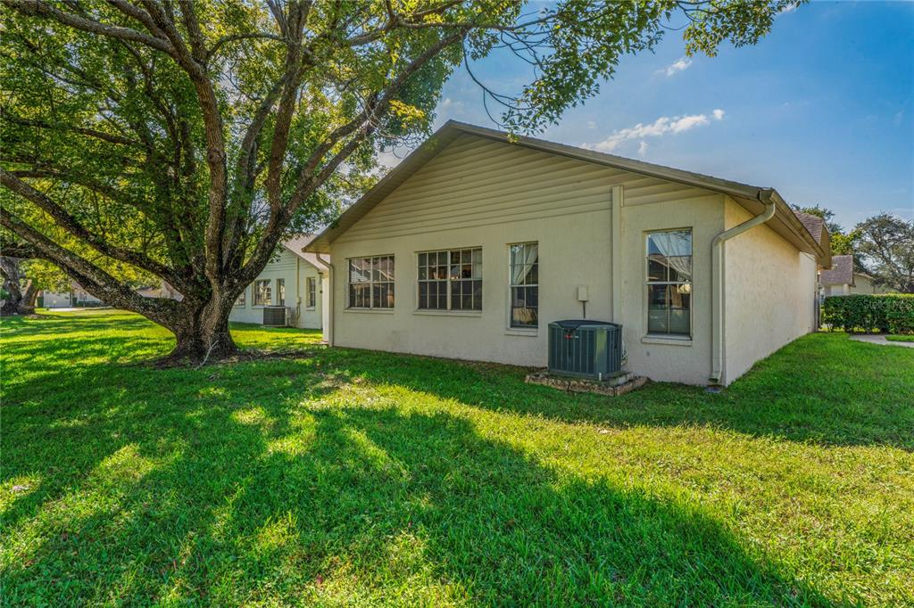 4740 Carrington Court New Port Richey, FL 34655 - Photo 12 of 66 a view of a house with backyard