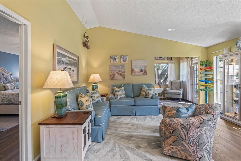 4740 Carrington Court New Port Richey, FL 34655 - Photo 15 of 66 a living room with furniture and a lamp