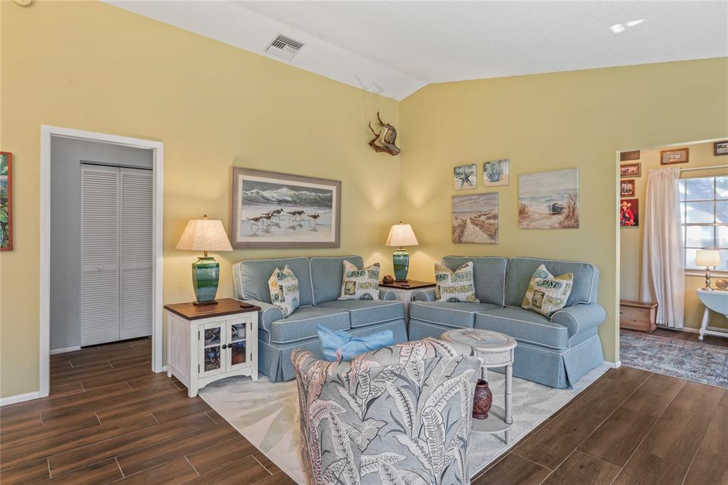 4740 Carrington Court New Port Richey, FL 34655 - Photo 16 of 66 a living room with furniture and a wooden floor