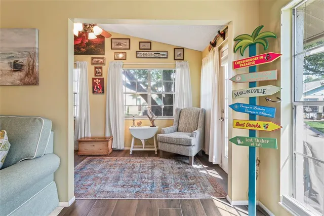 a view of a dining room with furniture wooden floor and a chandelier