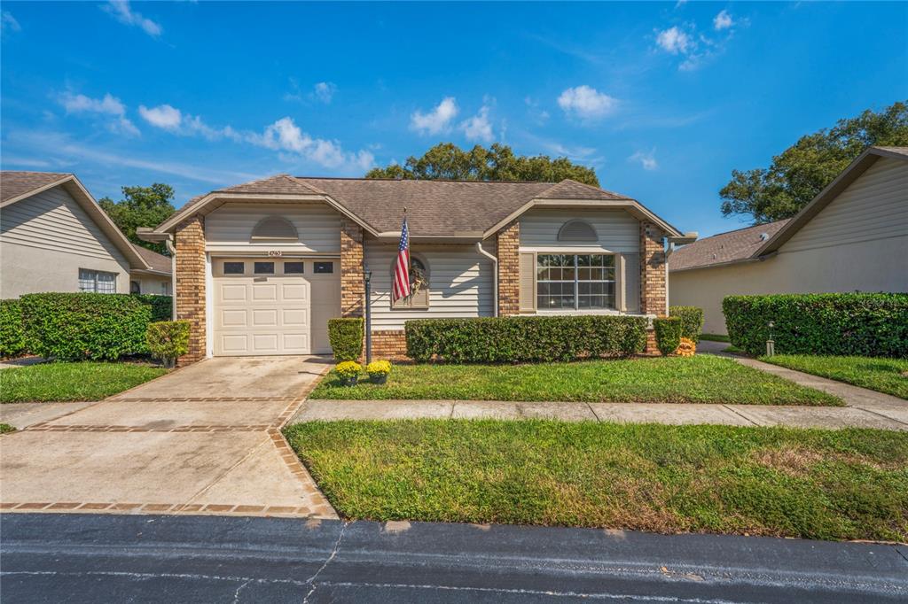 4740 Carrington Court New Port Richey, FL 34655 - Photo 2 of 66 a front view of a house with a yard