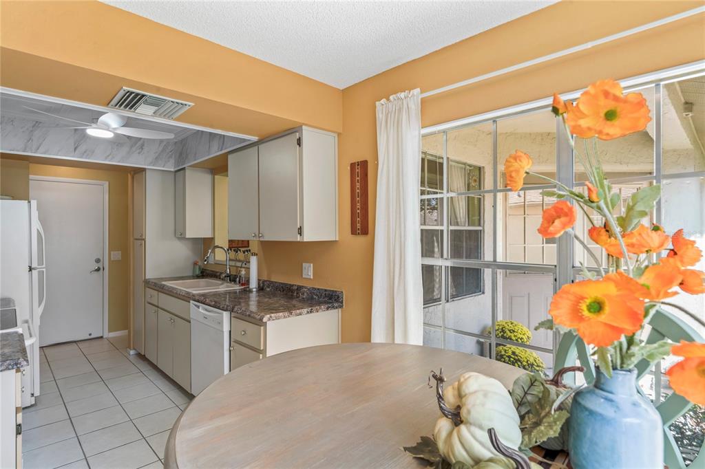 4740 Carrington Court New Port Richey, FL 34655 - Photo 29 of 66 a kitchen with stainless steel appliances granite countertop a sink and a cabinets