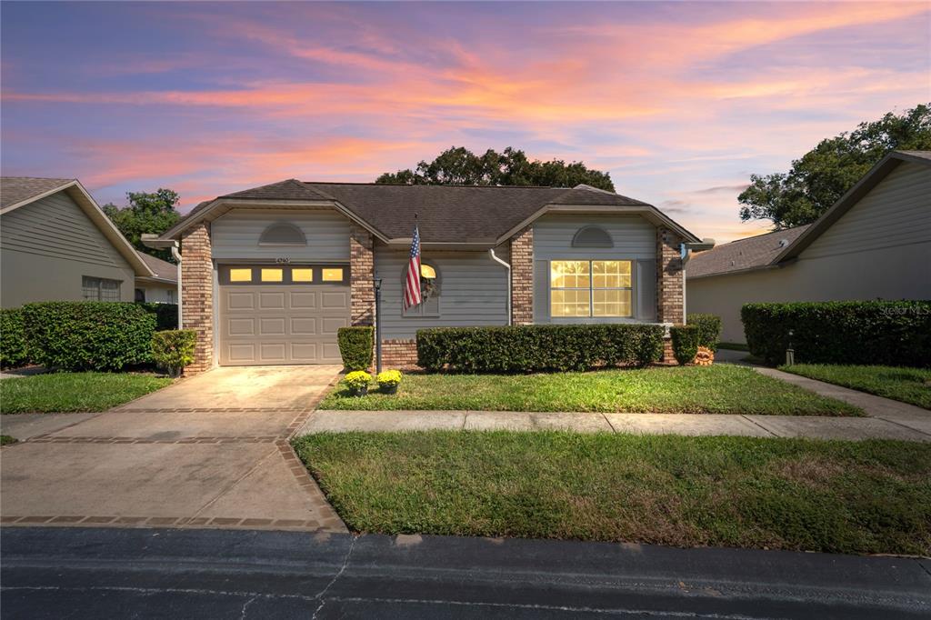 4740 Carrington Court New Port Richey, FL 34655 - Photo 3 of 66 a front view of a house with a yard