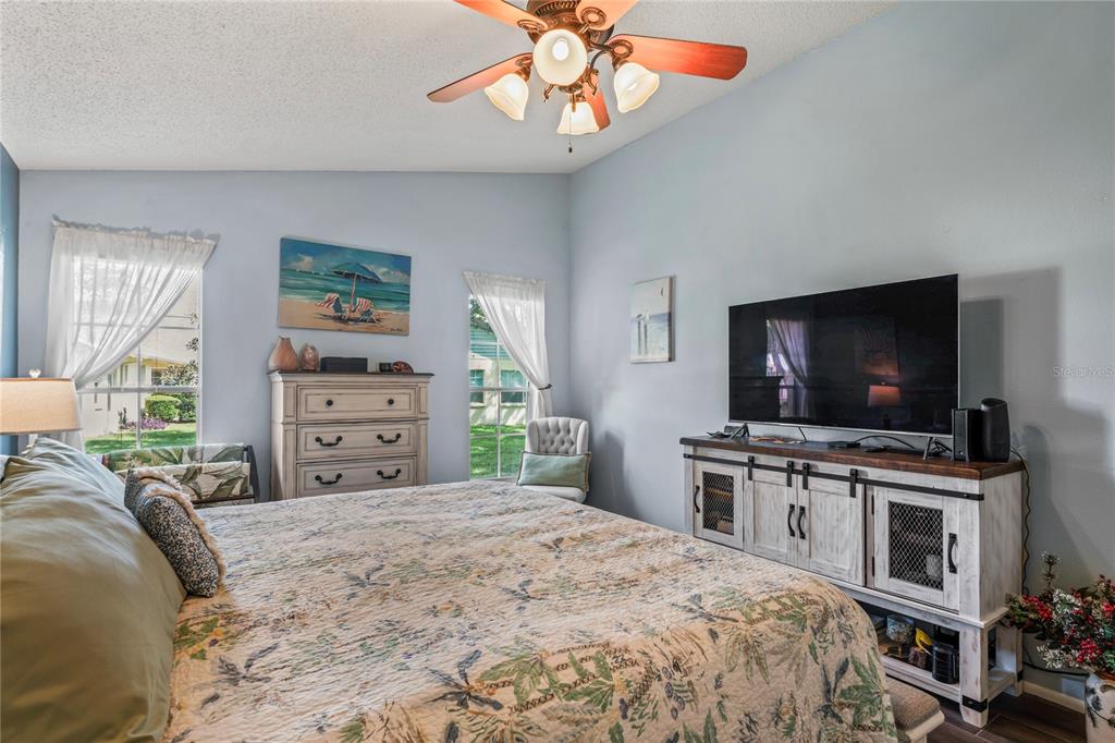 4740 Carrington Court New Port Richey, FL 34655 - Photo 31 of 66 a bedroom with a bed and a flat screen tv