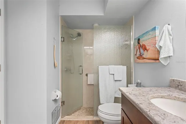 a bathroom with a granite countertop double vanity sinks and a mirror