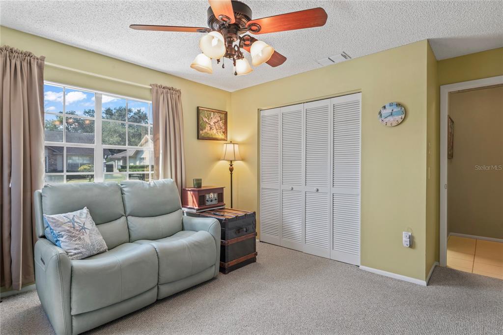 4740 Carrington Court New Port Richey, FL 34655 - Photo 39 of 66 a living room with furniture and a large window