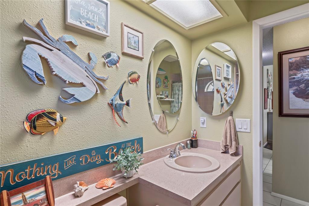 4740 Carrington Court New Port Richey, FL 34655 - Photo 42 of 66 a bathroom with a granite countertop double vanity sinks and a mirror