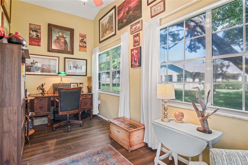 4740 Carrington Court New Port Richey, FL 34655 - Photo 43 of 66 a view of a workspace with furniture and a window