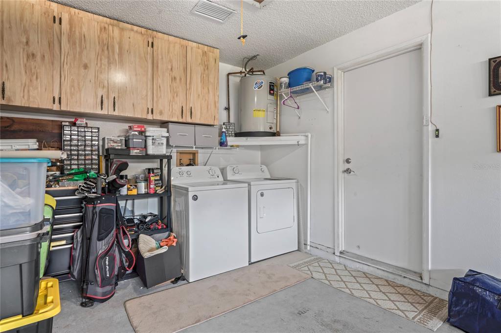 4740 Carrington Court New Port Richey, FL 34655 - Photo 46 of 66 a view of storage and utility room
