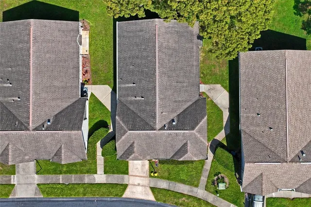 a view of an house with backyard space and balcony
