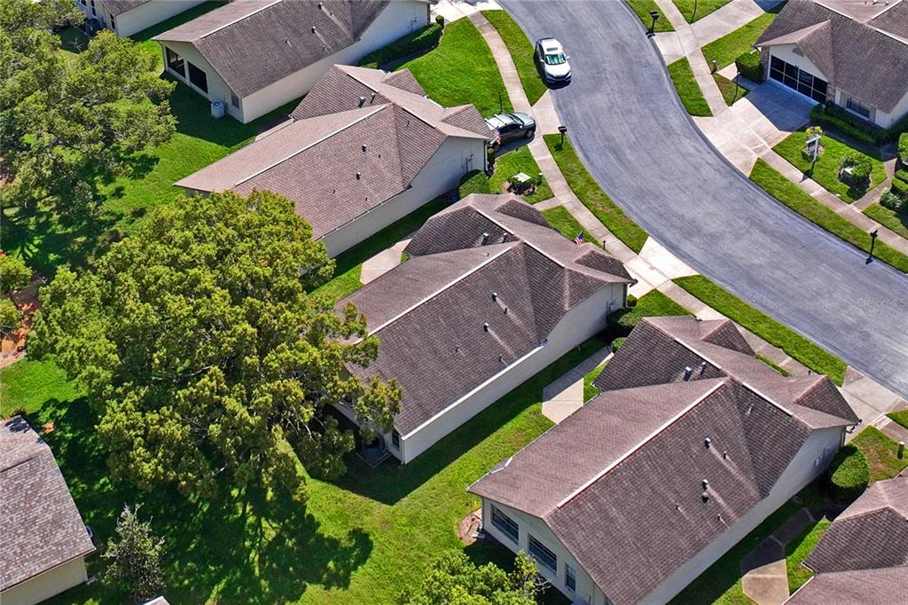 4740 Carrington Court New Port Richey, FL 34655 - Photo 49 of 66 an aerial view of a house with a garden