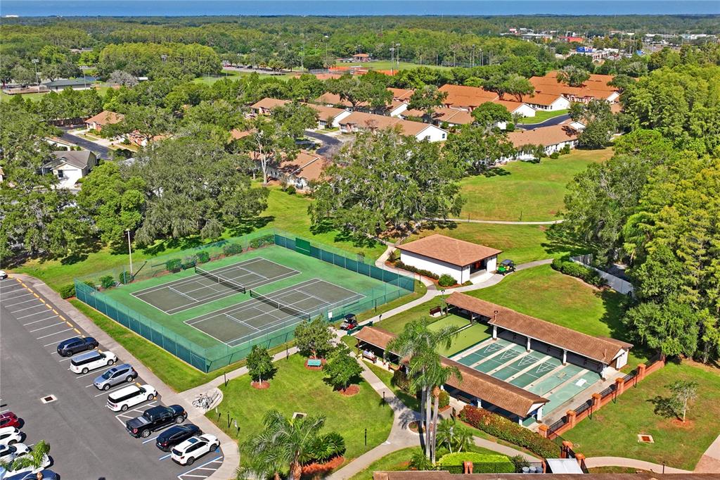 4740 Carrington Court New Port Richey, FL 34655 - Photo 61 of 66 an aerial view of a tennis ground and a yard