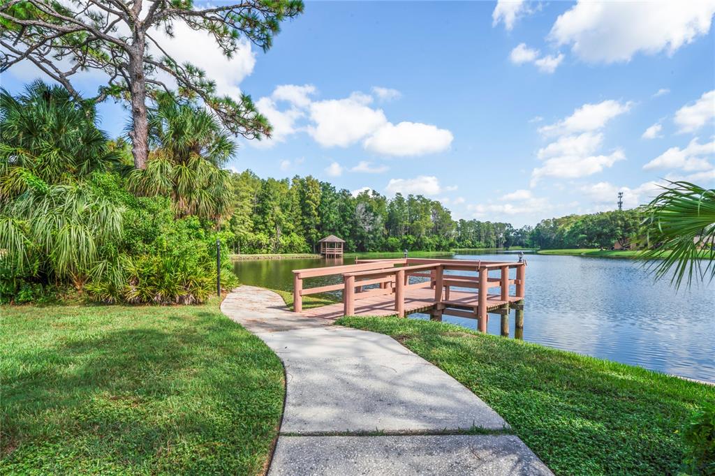 4740 Carrington Court New Port Richey, FL 34655 - Photo 66 of 66 an outdoor view of a garden with sitting area