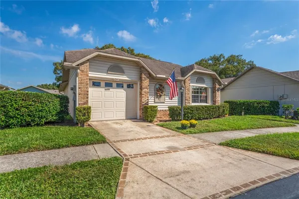a aerial view of a house with a yard and plants