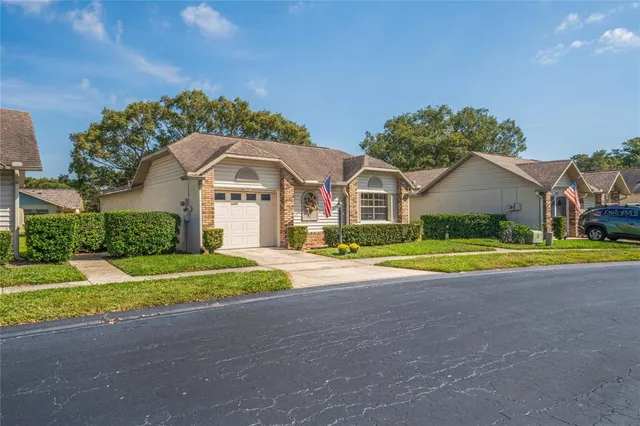 a view of a house with backyard