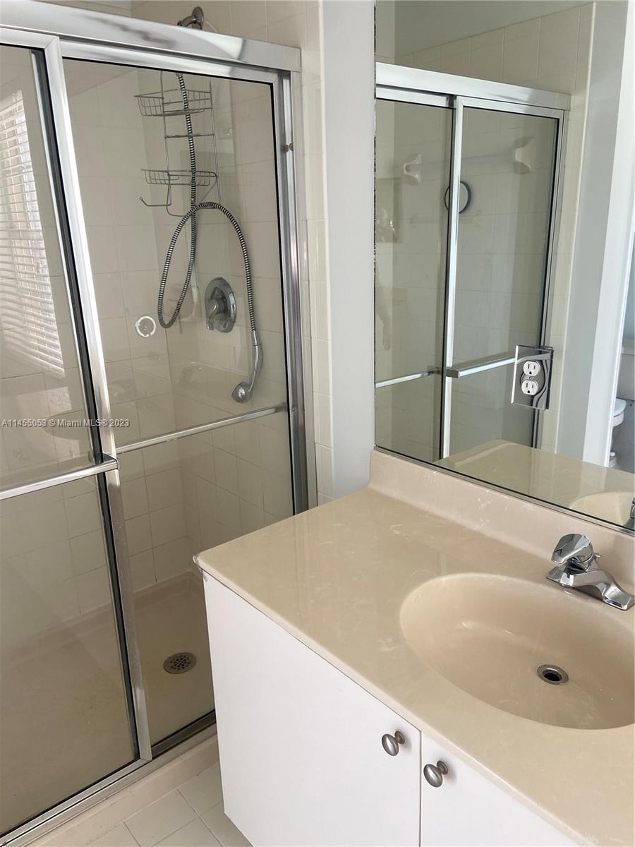 2001 Southwest 157th Avenue Miramar, FL 33027 - Photo 14 of 20 a bathroom with a tub and shower