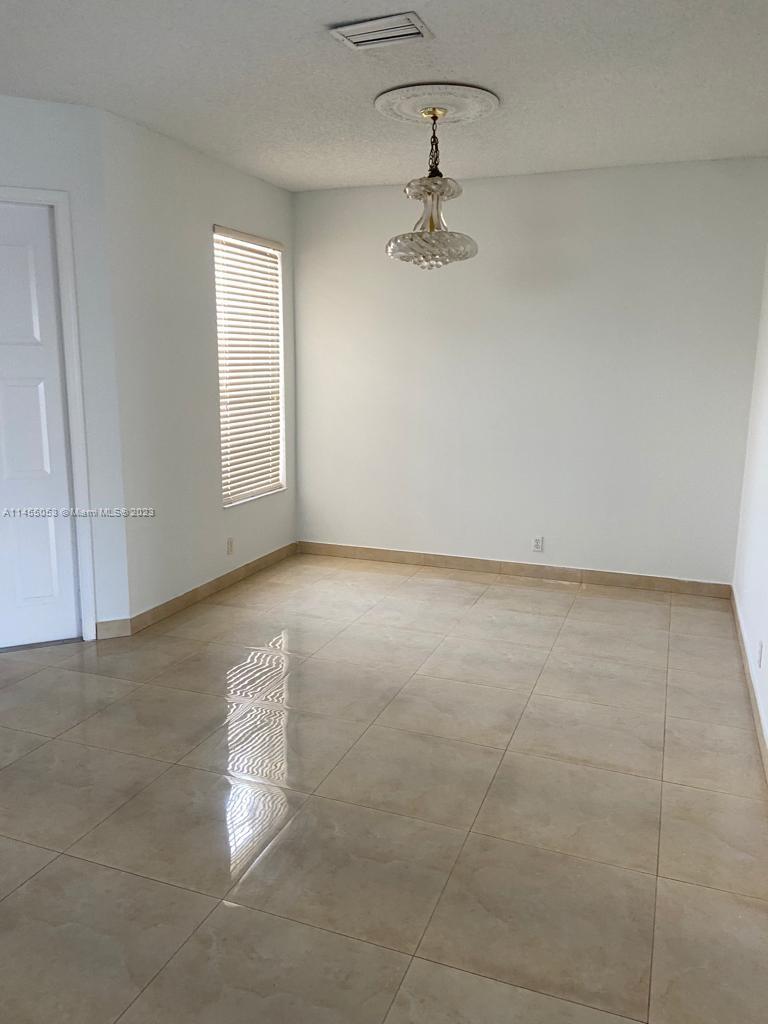 2001 Southwest 157th Avenue Miramar, FL 33027 - Photo 19 of 20 an empty room with a empty space and windows