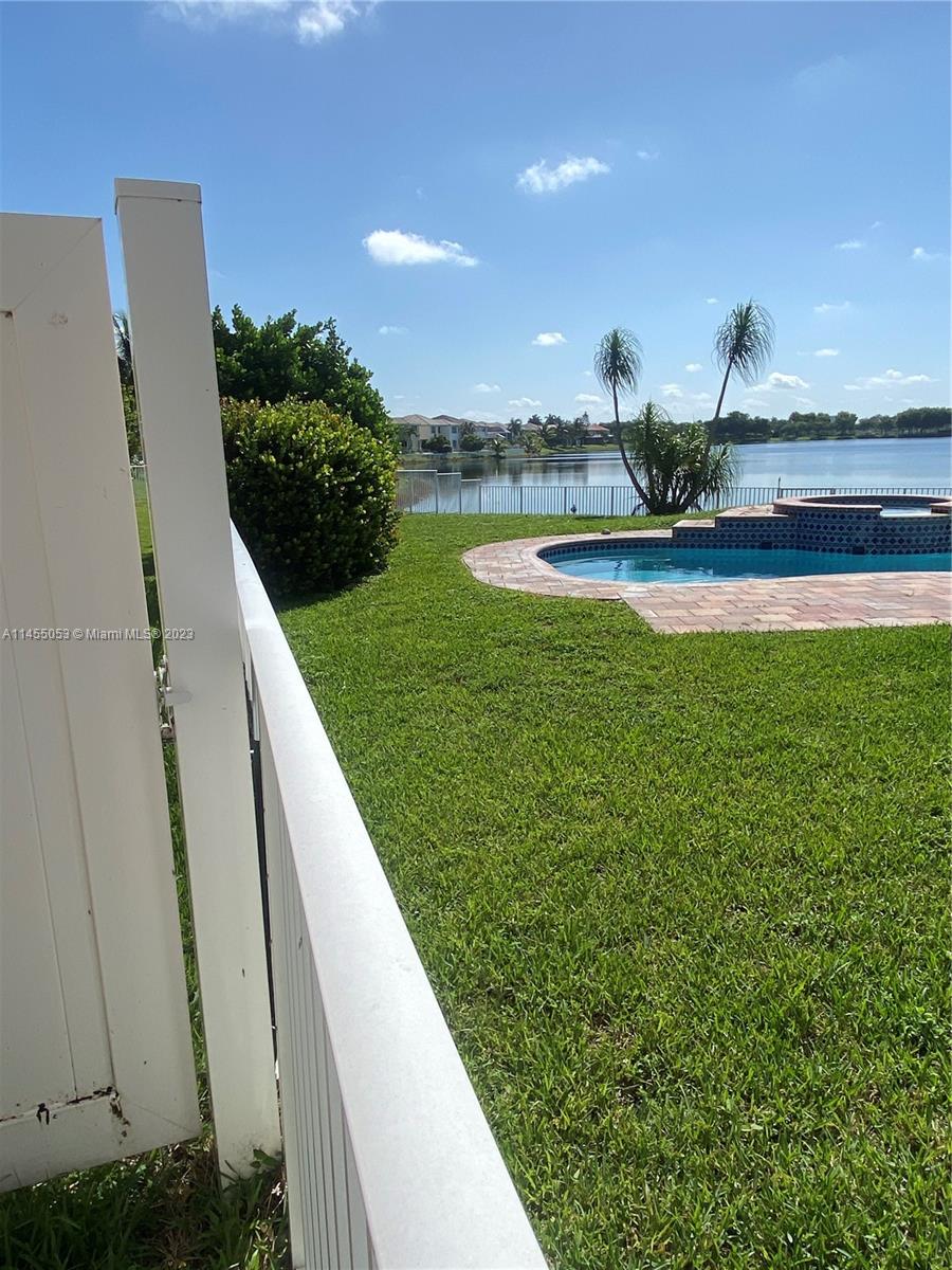 2001 Southwest 157th Avenue Miramar, FL 33027 - Photo 8 of 20 a view of a swimming pool and a yard