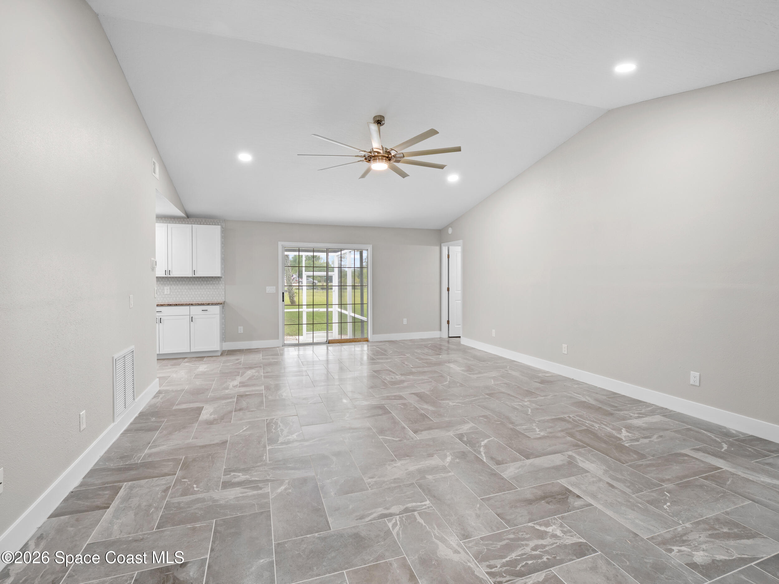 3480 Weber Road Malabar, FL 32950 - Photo 7 of 45 a view of an empty room with a window