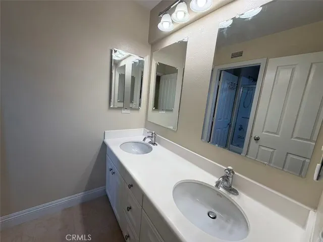 a view of a playground with lots of green space and slide