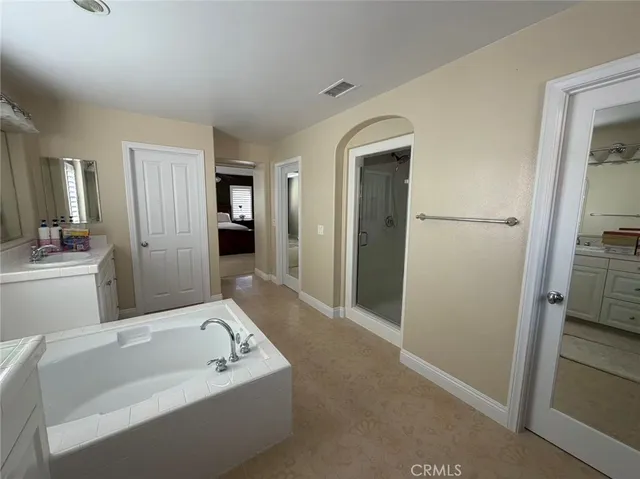 a bathroom with a bathtub and a sink