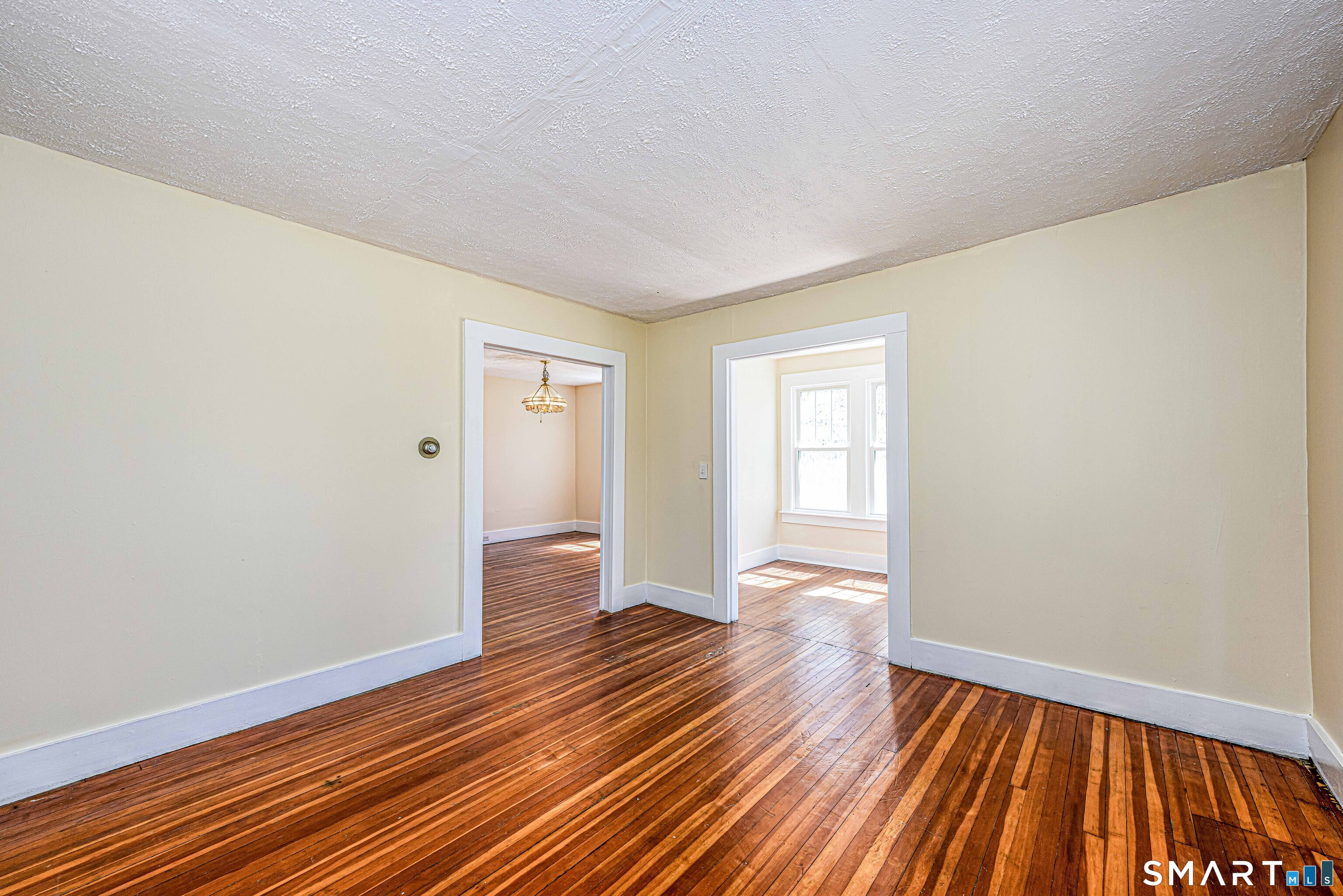 45 Rimmon Road North Haven, CT 06473 - Photo 8 of 40 Living room with sunroom on the right and dining through the left door