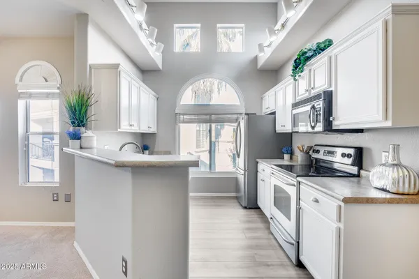 a picture of a cabinet with a white wall and white walls
