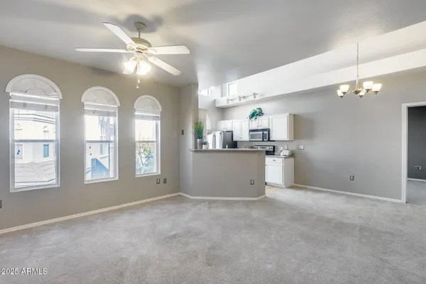 a view of a kitchen and chandelier