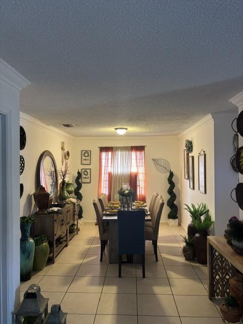 6207 Adriatic Way West Palm Beach, FL 33413 - Photo 16 of 26 a view of a dining room with furniture and chandelier