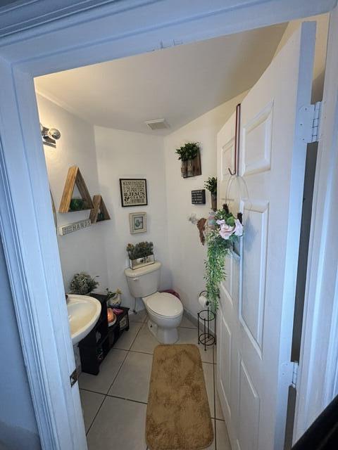 6207 Adriatic Way West Palm Beach, FL 33413 - Photo 17 of 26 a view of a toilet in a bathroom