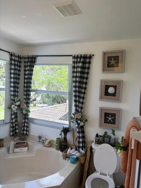 6207 Adriatic Way West Palm Beach, FL 33413 - Photo 21 of 26 a bath room with a couch and a large window