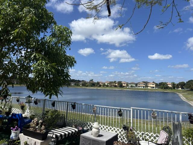 6207 Adriatic Way West Palm Beach, FL 33413 - Photo 7 of 26 a view of a chairs and tables on the terrace
