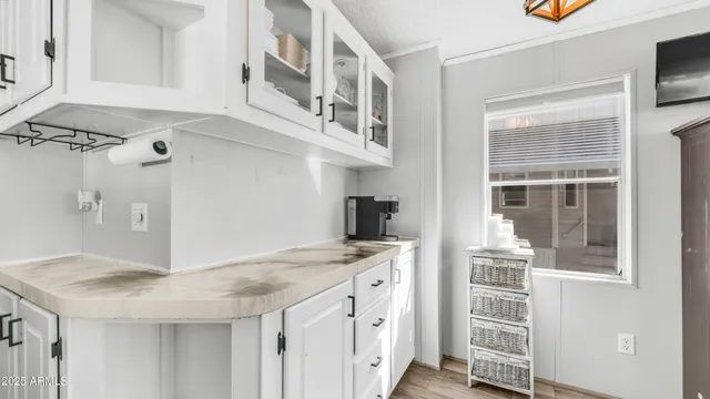 a view of a kitchen with cabinets