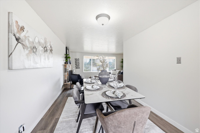 215 Carol Way Midvale, UT 84047 - Photo 8 of 30 Dining area with wood finished floors and baseboards