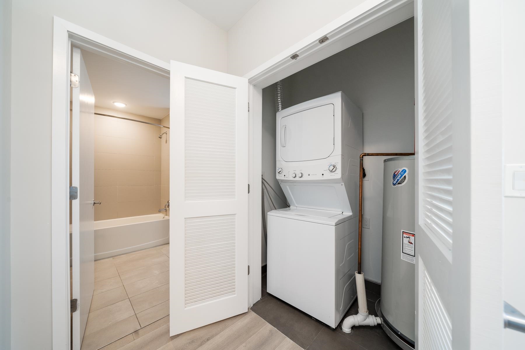 16 Bennett Street, Unit 211 Jersey City, NJ 07304 - Photo 16 of 24 a utility room with dryer and washer