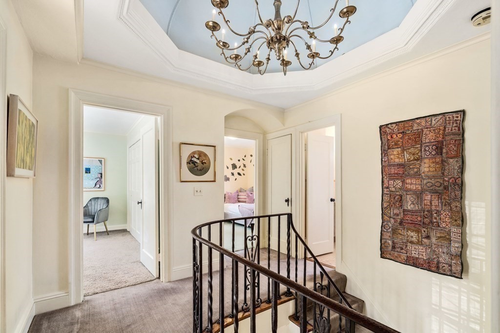 204 Lancaster Terrace Brookline, MA 02446 - Photo 13 of 32 a view of a hallway with a chandelier