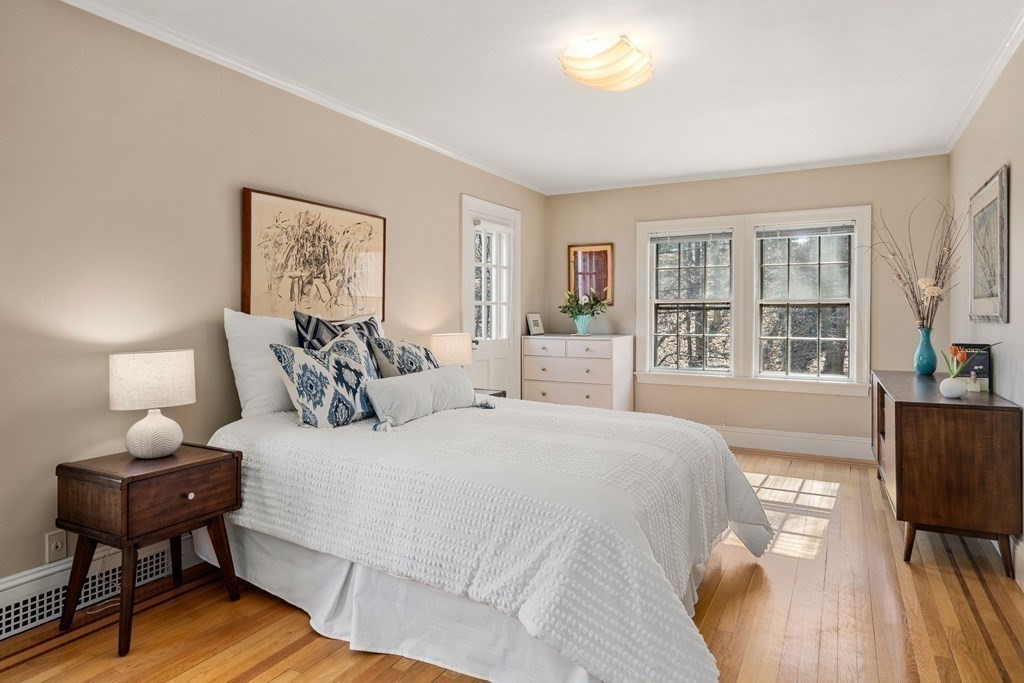 204 Lancaster Terrace Brookline, MA 02446 - Photo 14 of 32 a spacious bedroom with a bed and a window