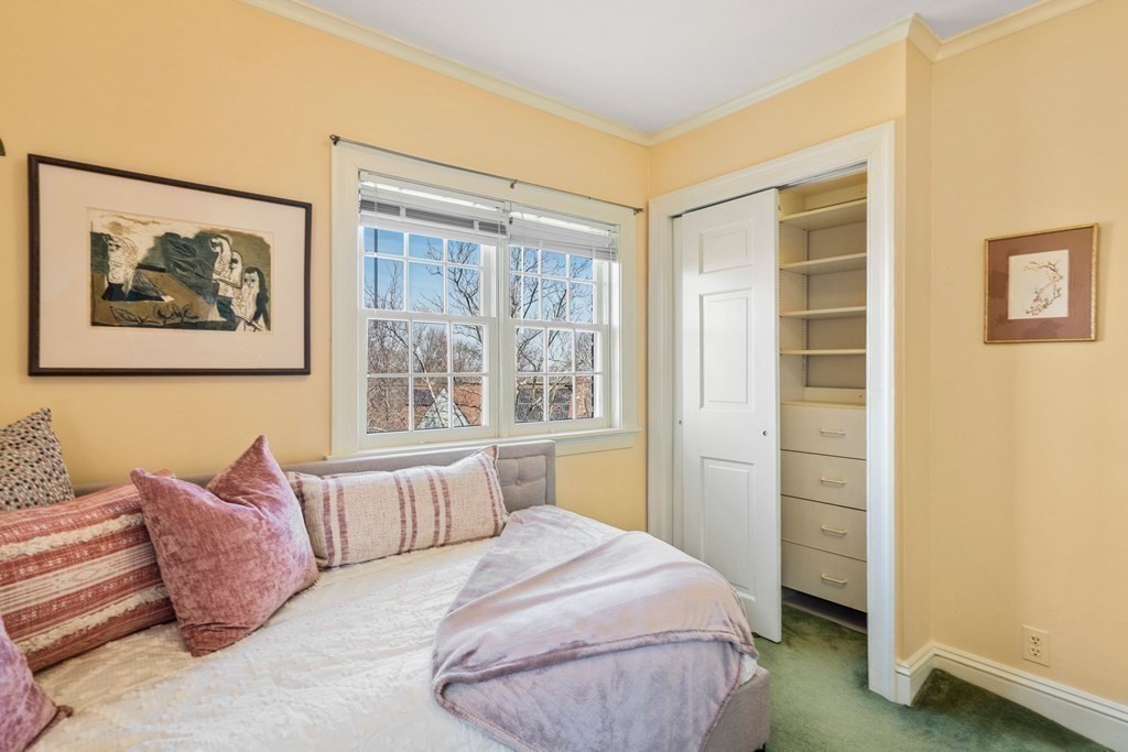 204 Lancaster Terrace Brookline, MA 02446 - Photo 20 of 32 a bedroom with a bed and a window