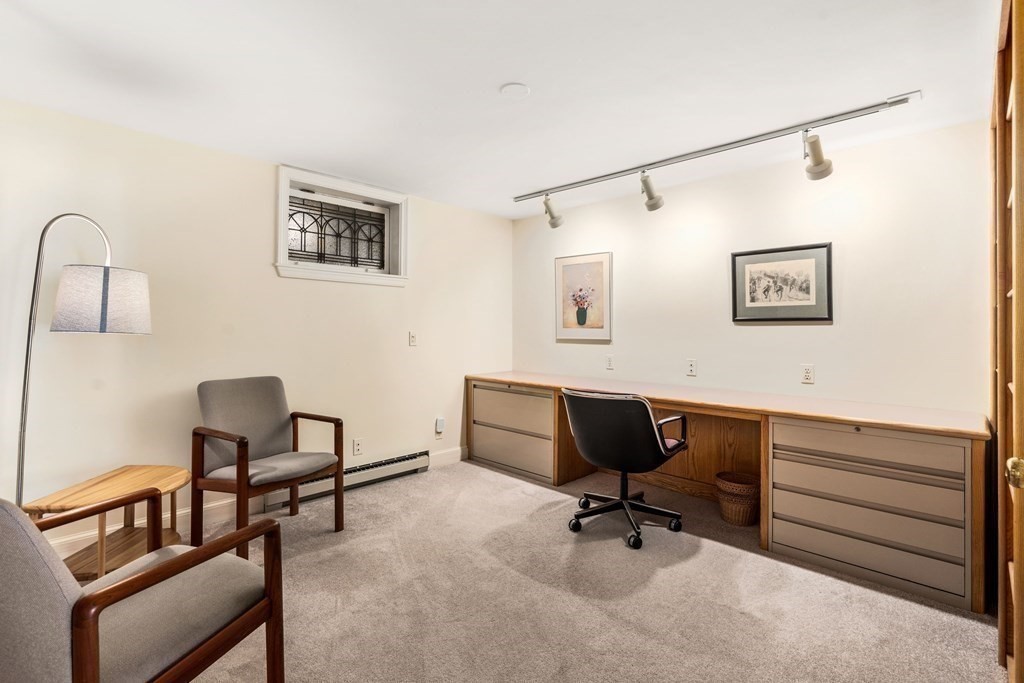 204 Lancaster Terrace Brookline, MA 02446 - Photo 22 of 32 a view of a workspace with furniture and a window