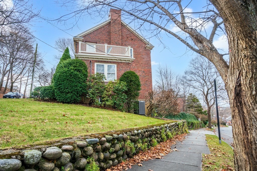 204 Lancaster Terrace Brookline, MA 02446 - Photo 24 of 32 a backyard of a house with lots of green space