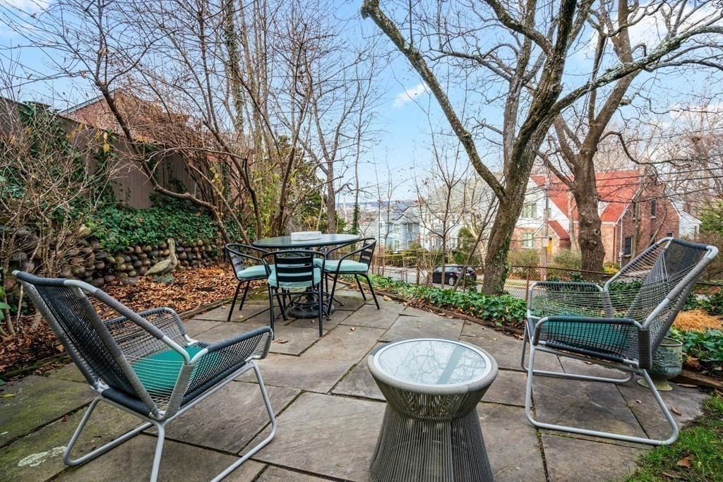 204 Lancaster Terrace Brookline, MA 02446 - Photo 27 of 32 a view of a backyard with sitting area and furniture
