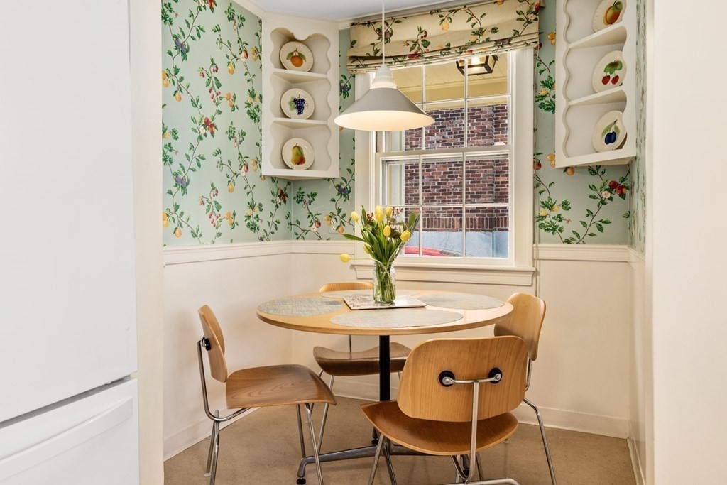 204 Lancaster Terrace Brookline, MA 02446 - Photo 5 of 32 a view of a dining room with furniture and a chandelier